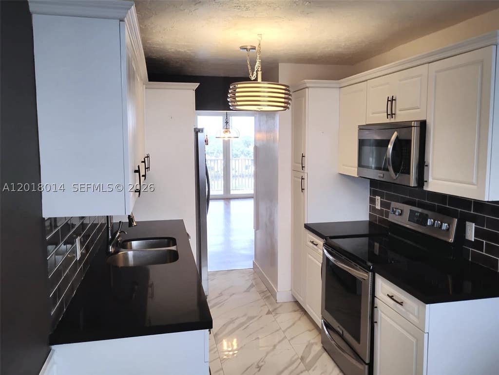 Photo of 250 Jacaranda Dr #608, Plantation, FL 33324 (MLS # A12018014)