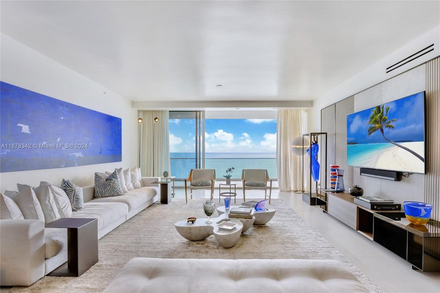 This stunning oceanfront residence, fully customized by renowned architect Carlo Colombo, offers a blend of sophistication and elegance. A glass wine cellar artfully separates the kitchen from the dining living areas, while the den has been transformed into a refined office space. Each bedroom features custom-built walls & bespoke closets, adding to the home’s tailored design. The living room stands out with a wood-paneled wall covered in Alcantara, creating a warm and inviting ambiance. Floor-to-ceiling doors & high-end upgrades elevate this space, making it truly exceptional. Oceana Bal Harbour provides residents with an unparalleled lifestyle, featuring two pools, private beach service, tennis courts, a spa and fitness center, valet services, and a restaurant.