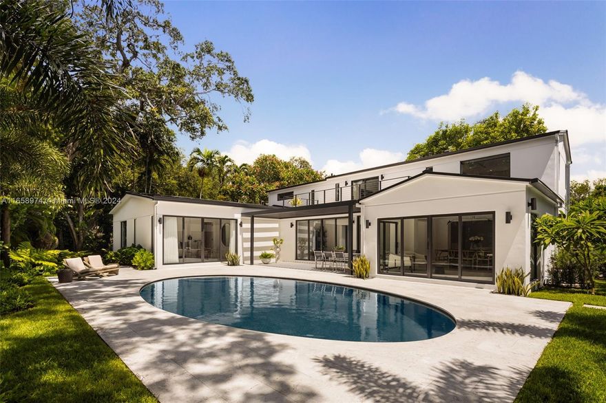 Newly completed and expertly designed 4,228 SF gated residence with 5-bedrooms and 5.5-bathrooms, on a generous 10,700 SF lot in a highly sought-after North Grove neighborhood. The open, airy floor plan is filled with natural light,  showcases beautiful hardwood floors throughout, and offers interiors crafted by the renowned Farache Bromberg Design Studio. A gourmet kitchen boasts sleek custom cabinetry, Neolith Travertine countertops, high-end Miele appliances, and a dedicated dining space. Perfectly suited for entertaining, the beautifully landscaped backyard includes an oval-shaped pool, limestone deck, and trellis. Other features include impact windows and doors, exquisite millwork, oversized terrace, fireplace, and garage.