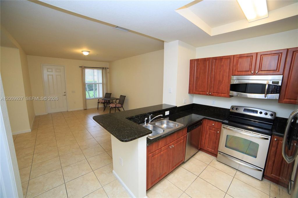 Photo of 4501 Mimosa Ter #1409, Coconut Creek, FL 33073 (MLS # A12009927)