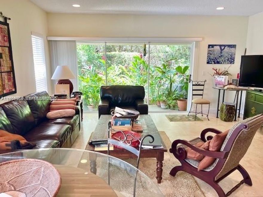 A MUST SEE!!! GORGEOUS END UNIT IN THE HEART OF WPB! THIS BRIGHT, SPACIOUS HOME BACKS UP TO A PRESERVE FOR FULL PRIVACY. A LARGE EASEMENT ON THE SIDE OFFERS LIGHT, PRIVACY AND TONS OF SPACE! EXCELLENT LOCATION NEAR SHOPS, RESTAURAMTS, SCHOOLS, BEACHES, I95 AND THE TURNPIKE. LARGE OPEN KITCHEN OVERLOOKS SPACIOUS DINING AND FAMILY ROOMS. BEAUTIFUL GARDEN VIEW. MARBLE FLOORS THROUGHOUT FIRST FLOOR, FRESHLY PAINTED. COMMUNITY FEATURES GATED ENTRANCE, SWIMMING POOL, PLAY AREA AND MORE! ASSOC. DUES INCLUDE CABLE, INTERNET ACCESS, ALARM MONITORING.