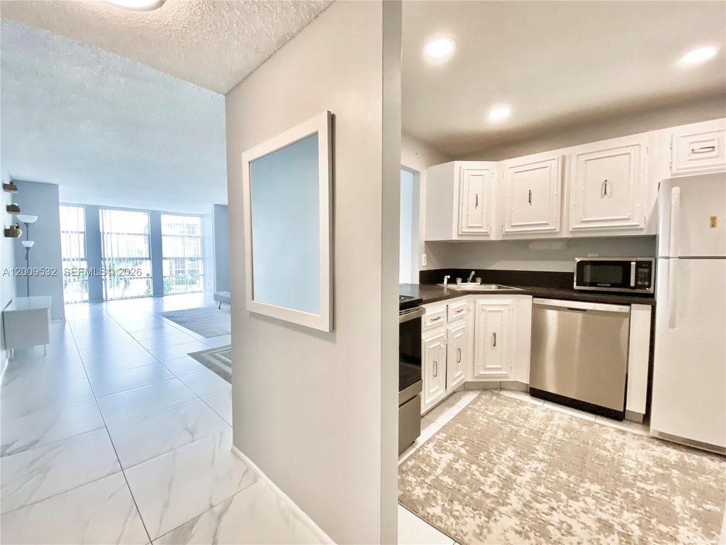 Photo of 601 Three Islands Blvd #314, Hallandale Beach, FL 33009 (MLS # A12009532)