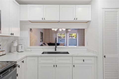 Photo of 11611 NW 11th St #11611, Pembroke Pines, FL 33026 (MLS # A11938904)