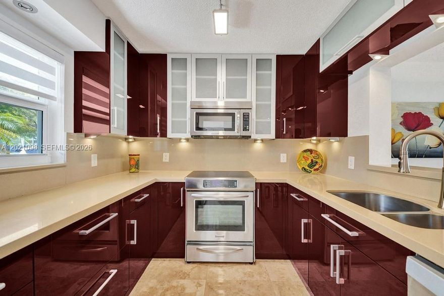 No expense was spared in the complete renovation of this beautifully appointed condo. Top-of-the-line finishes are showcased throughout. Every detail is brand new and thoughtfully completed with permits. Washer & dryer in unit! Impact windows and doors provide both style and peace of mind. The open-concept kitchen is designed for effortless everyday living and entertaining. Serene lake views enhance the home's tranquil setting. Desirable ground-floor location adds comfort and convenience. Reserved parking directly in front of the residence offers exceptional ease. This corner unit offers added privacy and natural light. Close to the beach, airport, Port Everglades, shopping, dining, casinos. OK to lease minimum 90 days, 1 time per year, after 1 year of ownership. 
An in-unit washer and dryer add to the home's everyday convenience.
Elegant marble flooring extends throughout the residence.
Located within a sought-after active adult community.
Ideally situated near the beach, golf, tennis, and casinos, with convenient access to both Fort Lauderdale and Miami.