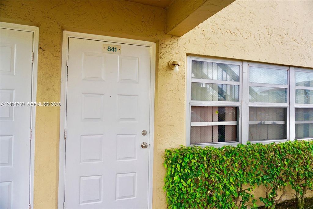 Photo of 841 Twin Lakes Dr #30-A, Coral Springs, FL 33071 (MLS # A12032719)