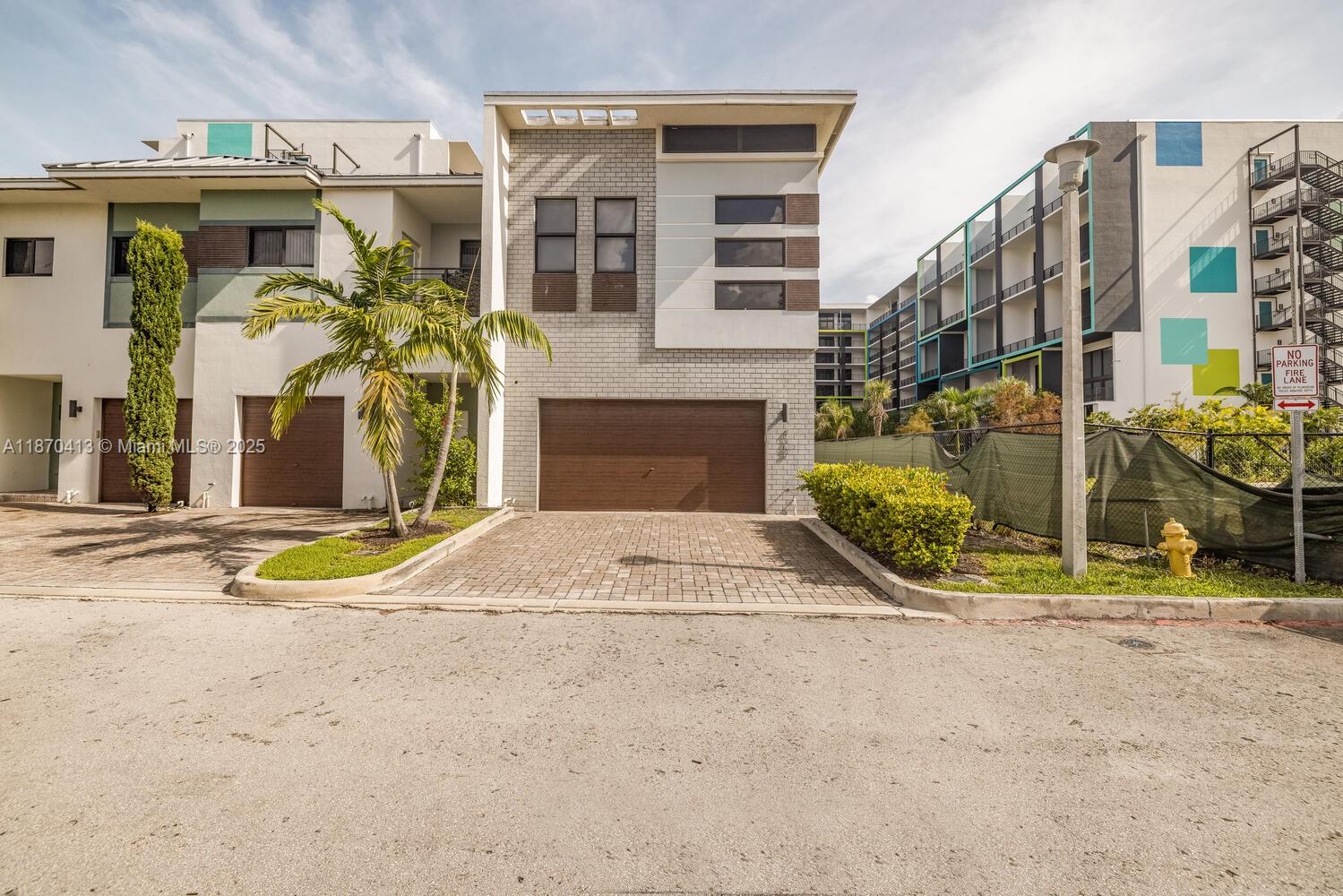 This stunning corner-unit townhome offers 3 bedrooms, 2.5 baths, and a spacious two-car garage in the heart of Plantation. Located in the gated community of Strata at Plantation, this residence blends modern design with everyday comfort. The gourmet kitchen features a two-tier countertop and stainless steel appliances, flowing seamlessly into the open living and dining areas, bathed in natural light from extra corner windows. Upstairs, the master suite is a serene retreat with a walk-in closet and spa-like ensuite, while two additional bedrooms provide generous space for family or guests. Additional highlights include impact windows, LED lighting, and a private balcony. Strata at Plantation offers resort-style amenities including a pool, fitness center, dog park, and clubhouse.