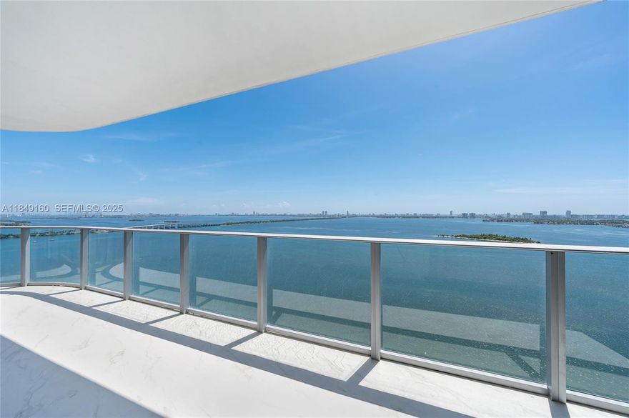 Residence 2301 at Aria Reserve is a luxurious corner 4-bedroom plus den, 5.5-bath home-in-the-sky with a clean, open-concept gourmet kitchen and flexible den. Sunlit interiors feature floor-to-ceiling impact glass offering sweeping, unobstructed views of Biscayne Bay, the Atlantic, and the Miami skyline. Entry is ultra-private via a vestibule served by two private high-speed elevators. Each bedroom has its own en-suite bath and elegant finishes throughout elevate the design. Owners enjoy over two acres of resort-style amenities—bayfront pools, spa and wellness facilities, co-working lounges, marina, café/restaurant, kids’ zones, plus 24-hour concierge and valet. Two adjacent assigned garage parking spaces are included. Private showings available with 24-hour notice.