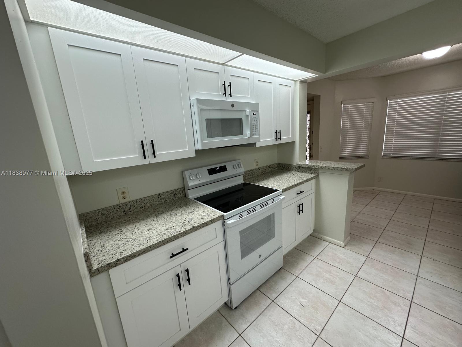 Completely renovated 2/2 condo in Century Village features brand new kitchen appliances, cabinets, and granite countertops. Both bathrooms have new cabinets and countertops as well. The entire unit has been freshly painted and it has a washer/dryer inside the unit for your convenience. You will feel like you are walking into your new home...this will not stay on the market long. ***Please click ShowAssist for EZ showing instructions*** ((min 650 credit score required as per Association))