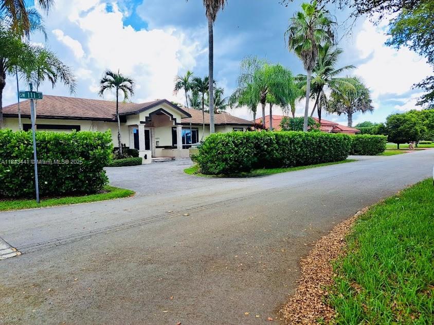 SINGLE-FAMILY HOME WITH 5 BEDROOMS, 4 AND 1/2 BATHROOMS, CORNER LOT, SPACE TO PARK A BOAT ON CONCRETE, CONCRETE SLAB WITH POWER FOR RV PARKING IN THE BACK, CENTRALLY LOCATED BY SR874 AND SR878, WITH 15,933 SF, NICE COVERED TERRACE OVERLOOKING THE POOL WITH SUNSHADES, GAZIBO WITH POWER, PERFECT FOR ENTERTAINING OR RELAXING. 30FT VAULTED CIELINGS WITH EXPOSED WOOD BEAMS IN THE LIVING ROOM CREATS A HUGE OPEN CONCEPT SPACE, RARE FIND, EATING KITCHEN, LOFT/OFFICE, 2 CAR GARAGE, IMPACT WINDOWS, 2017 ROOF, HUGE DRIVEWAY, WOOD FENCE, TALL CLUSIAS SURROUND THE WHOLE HOUSE CREATING A PRIVATE PARADISE. TWO MANGO TREES, AN AVOCADO TREE, AND A GUAVA TREE.