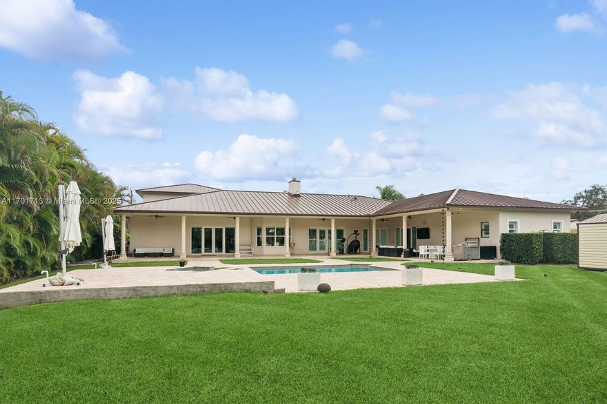 This lavish home has been upgraded with premium features and cutting-edge technology providing a luxurious living experience. Every detail has been carefully considered to enhance both comfort and style, offering the perfect balance of sophistication and functionality. These are some of the outstanding upgrades that make this home a true masterpiece: Savant & Lutron Smart Home System, Sonos Audio System, Impact Doors and Windows, Heat Reflecting Metal Roof (2019), New A/C unit (2024), Upgrated Lighting, En-Suite Bedrooms, Custom Closets, Modern Glass Door Wine Closet, Security and Surveillance system. These state of the art upgrates create a home that is not only visually stunning but also functional, secure and fully equipped for modern living.