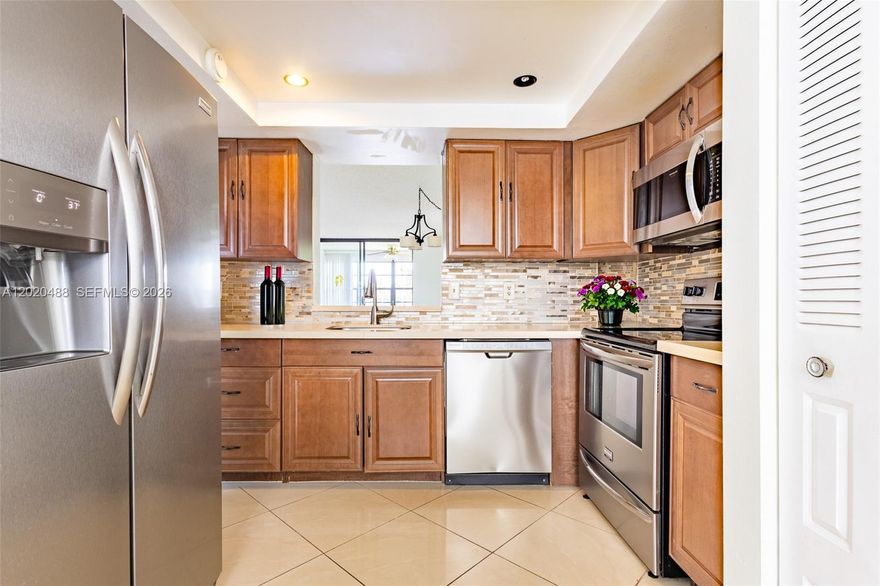 Beautifully renovated 2-bedroom, 2-bath condo located in the desirable Palm Springs 55+ community. This move-in-ready home features a bright and spacious layout with modern finishes, updated flooring, and comfortable living and dining areas perfect for enjoying the South Florida lifestyle. The updated kitchen and bathrooms offer contemporary touches, while the oversized primary suite includes generous closet space and added privacy. Enjoy peaceful mornings and relaxing evenings from your private screened balcony overlooking the beautifully maintained community grounds. Residents of Palm Springs have access to amenities including a sparkling community pool, clubhouse, lush landscaping, and scenic golf course surroundings. Conveniently located near shopping, dining, parks, golf courses, and major highways, this condo offers both comfort and convenience. HCA Florida Northwest Hospital is just minutes away and offers 24/7 emergency care and full medical services. Perfect as a full-time residence or seasonal retreat, this low-maintenance home offers easy Florida living at its best. Vacant and easy to show.