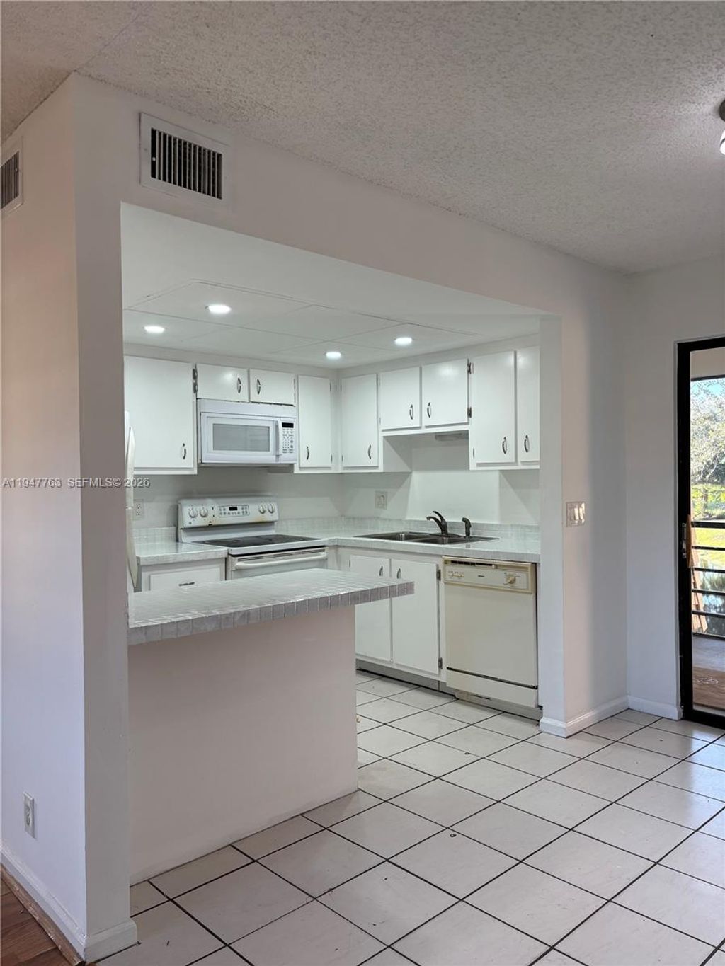 Photo of 4171 Oak Terrace Dr #4171, Green Acres, FL 33463 (MLS # A11947763)