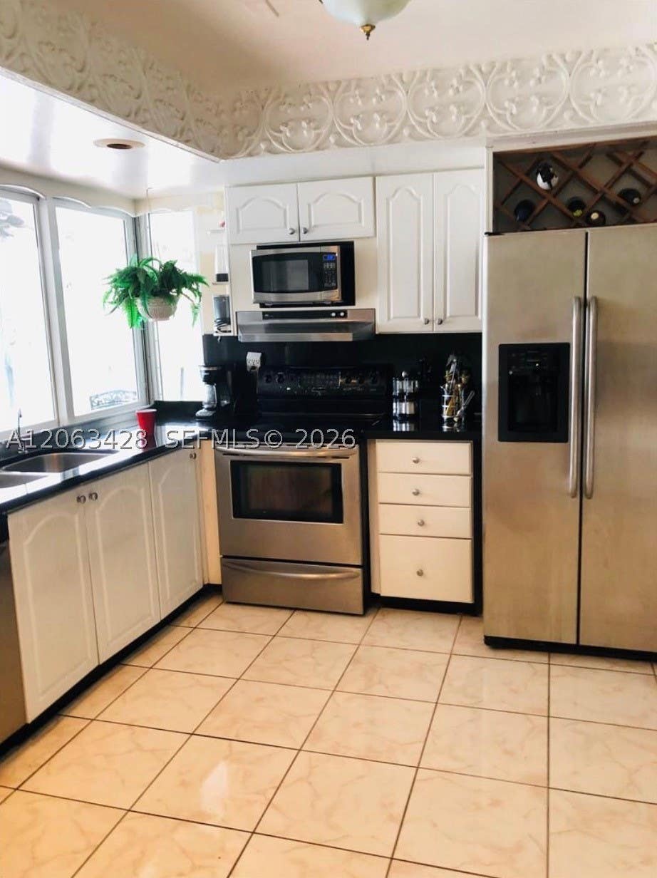 Photo of 2160 NW 82nd Ter, Sunrise, FL 33322 (MLS # A12063428)