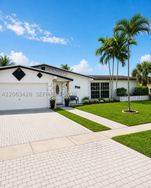 Photo of 2160 NW 82nd Ter, Sunrise, FL 33322 (MLS # A12063428)