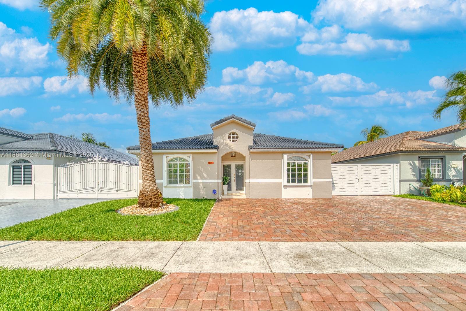 Welcome to this charming 3-bedroom, 2-bathroom home, perfect for comfort, entertainment, and South Florida living! This cozy residence offers a spacious side yard with room to park your boat or RV, plus an inviting covered patio, outdoor kitchen, and tiki hut—ideal for gatherings and year-round enjoyment. Inside, the home features a large kitchen with an island, seamlessly open to the family room for easy entertaining. The bedrooms are generously sized, and both bathrooms have been beautifully remodeled. A dedicated laundry room adds convenience to daily living. With indoor comfort and an outdoor retreat, this property is a true gem waiting to be enjoyed! Call today to schedule an appointment.
