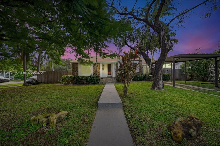 Curb appeal, Charm and Personality!  Location..live in the heart of it all! Attractive corner single family home with three bedrooms, two baths, family room and nice size fenced yard for outdoor living and entertaining.  Main bedroom with built out walk-in closet, private bath with rain shower and travertine tiles.  Second bedroom has quaint sitting area and two closets. Granite counter top kitchen with SS appliances. Impact windows throughout. Landscaping included with rent.  This home will steal your heart.  Look no more!