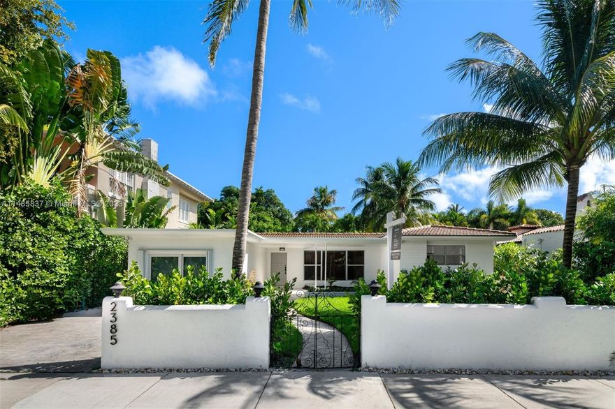 Captivating 3-bed/2.5-bath residence on Miami Beach! This home boasts potential, offering flexibility to expand. Step through delightful courtyard entry into open-concept space, seamlessly connecting living, dining, & family room. Kitchen features white cabinetry & offers a cozy space for a breakfast nook. Split floorplan ensures privacy, w/ dedicated primary suite featuring its own retreat. Two guest bedrooms conveniently situated off inviting living area. Outside, tropically landscaped backyard awaits, complete w/ patio, fruit trees, & shed. Lower N Bay Road is a sought-after location 10 minutes from trendy Sunset Harbor neighborhood – restaurants, juice bars, workout classes, marina & down the street from Miami Beach Golf Club.