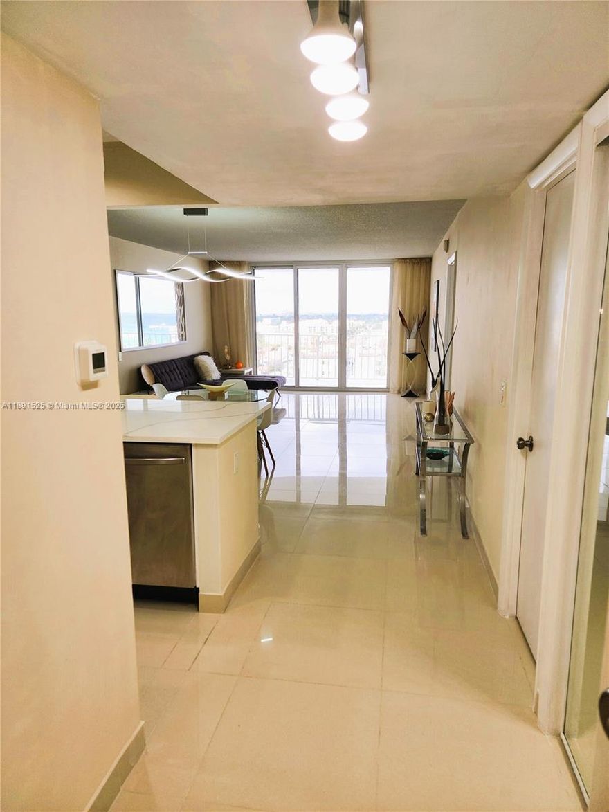 Beautifully Remodeled Oceanfront Condo with Tiki Paradise Vibes Experience oceanfront living in Deerfield Beach—your ideal coastal retreat. This remodelled condo offers stunning ocean views from a spacious balcony, including a direct sightline to the iconic Deerfield Pier. Inside, enjoy sleek porcelain flooring, a new electrical panel, impact windows, new AC, and an open kitchen with quartz countertops and stainless-steel appliances. Resort-style amenities include a private deeded beach with gated entry, heated pool, full gym, recreation and billiard rooms, tiki hut & BBQ area, private storage, and laundry next to the unit. Just a short stroll from vibrant Downtown Deerfield Beach with shops, dining, nightlife, and the world-famous fishing pier—this is coastal living done right