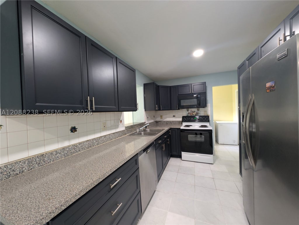 Photo of 2912 Sunshine Blvd, Miramar, FL 33023 (MLS # A12088238)