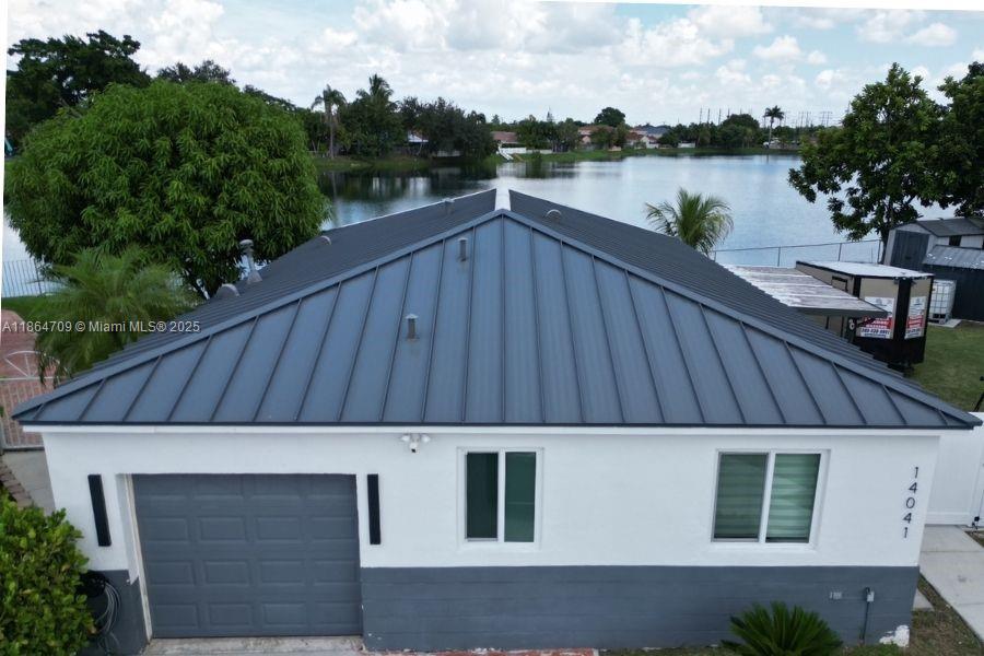 AMAZING OPPORTUNITY!!!! Buy with equity. Owners are motivated and must sell. Home has brand new metal roof, new hurricane impact windows and doors. Fresh exterior paint and covered patio with amazing lake views on a huge lot big enough for all your toys! This is a must see!