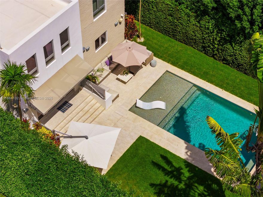 RENOVATED MIAMI BEACH VILLA WITH DETACHED COMFORTABLE & RELAXING GUEST HOUSE! Charming Walled & Gated Villa w/4,287 SF of Living Space on a classic 7,500 SF LOT. Main House w/3 Bedrooms + Office + 3 Baths. White & Bright Great Room w/14 FT Soaring Ceilings + Fireplace w/ Hand-painted Tiles & Elegant Staircase. Open Floorplan. Modern Chef’s Stainless Steel Eat-in Kitchen w/Viking Gas Range, Miele Appliances, SubZero Refrigerator & NewAir Wine Cooler. Oversized Heated Salt Water Pool & Lounging Areas Perfect for Outdoor Entertaining. Guest House w/Full Apartment complete w/Kitchen + Dining Area. Ground-floor Playroom w/Full bath & Kitchenette convertible to Bedroom. Lutron Lighting + Nest Thermostats. Driveway w/Solar-Powered Gates & Space for 3+ Cars. Minutes away from the Beach.