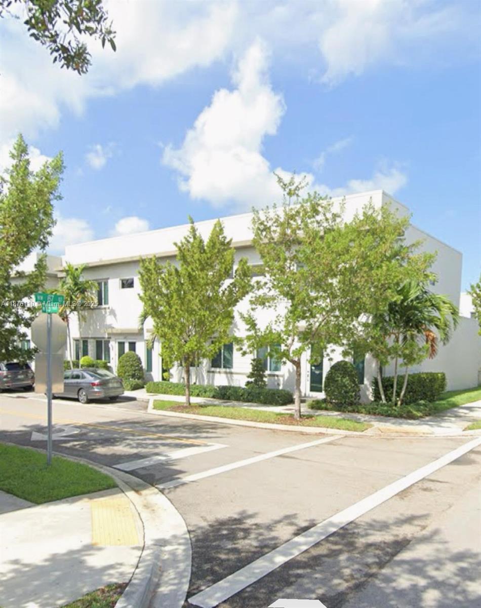 Luxury townhouse ready to move into the prestigious Landmark community. This modern unit features impact windows, 3 bedrooms, 2.5 bathrooms, 2 parking spaces in the back plus a garage for 1 car. An open design for living and dining room with a fully equipped kitchen and quartz countertop, stainless steel appliances, and a 3-door refrigerator. Private backyard. Master bedroom with walk-in closet and master bathroom with his and hers sinks, glass door shower, and separate toilet area; 2 perfectly sized bedrooms sharing a full bathroom, a laundry room with large washer and dryer. Beautiful clubhouse with tennis courts, pool, gym equipped with sauna, pool, and splash zone for kids. Top-tier public and private schools and public parks nearby.