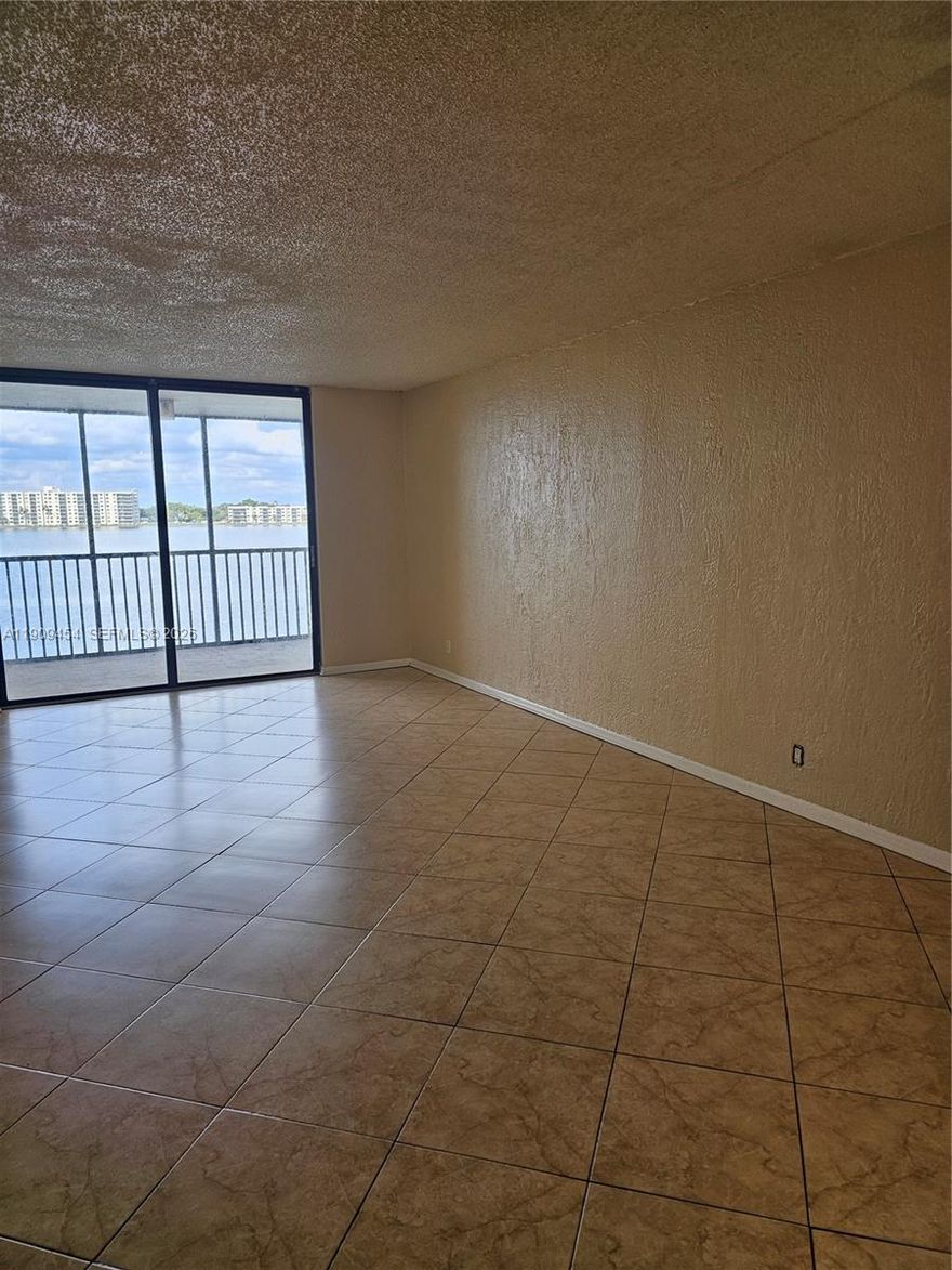 Serene water views from this penthouse unit on the largest lake in Broward County. Amenities include three pools, hot tubs, community room, library, tennis courts and more. Maintenance includes basic wifi and cable, trash removal and water. Tenant vacating the end of December 2025 and all assessments have been paid by seller for ongoing 40 year recertification. Great location, first building west of entrance! Seller would consider holding mortgage for qualified buyer. Park in owners spot, #2
