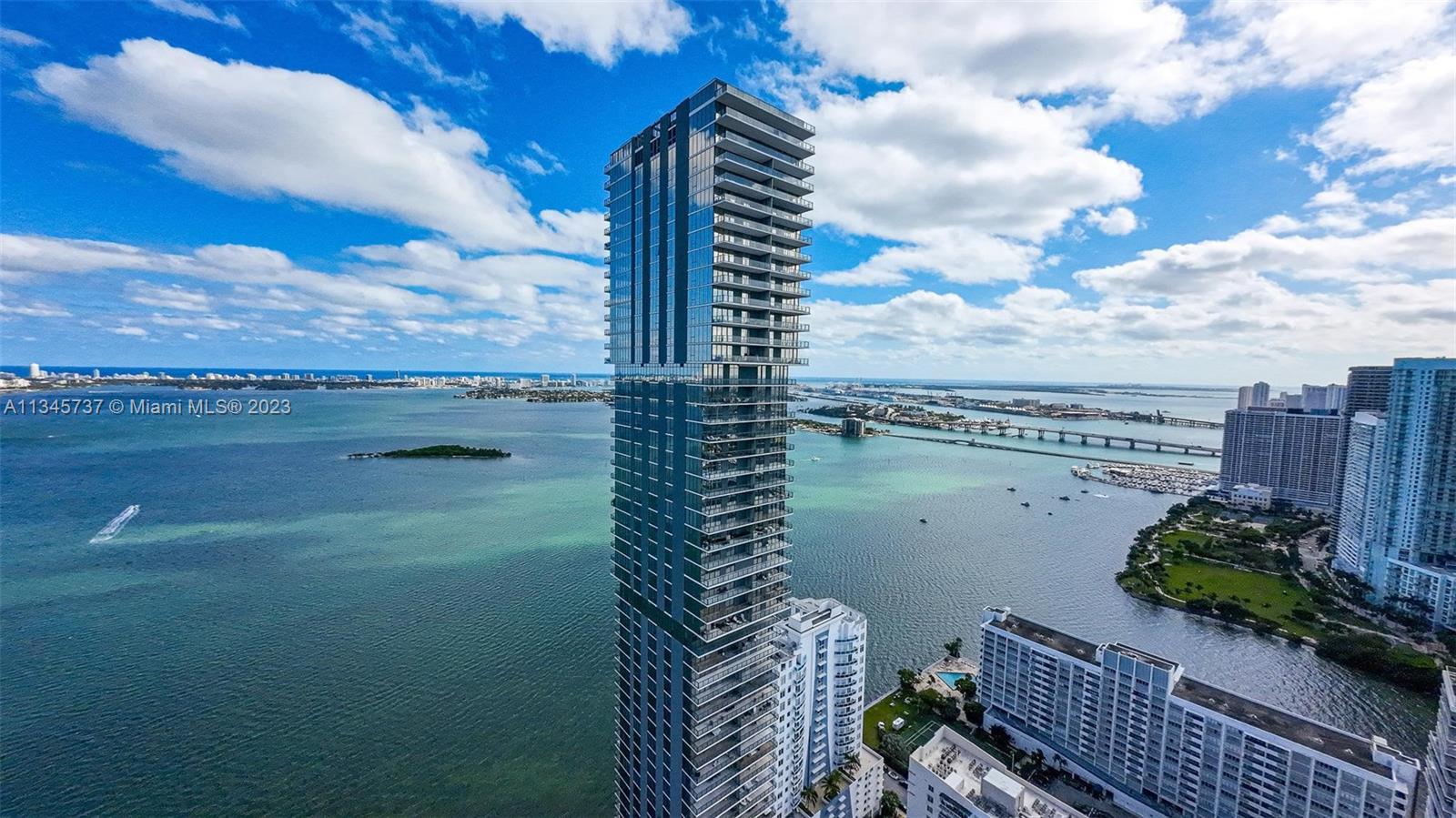 Elysee, the first luxury boutique building in Edgewater with architecture by world renowned Bernardo Fort-Brescia and Curated by interior designer Jean-Louis Deniot rises 57 floors above Biscayne Bay. 2 residences per floor and all flow-through. The magnificent floor plan of this furnished turnkey unit features 3bedroom + DEN (convertible to 4th bedroom) and 4.5 baths. Dropped ceilings in living area and Master bedroom, porcelain floors throughout and marble in bathrooms. Top of the line appliances.
Incredible amenities: library, screening room, grand dining room, complete with a catering kitchen and chef’s table, 2 pools, summer kitchen, fitness center, dedicated spa with sauna, steam room, shower and massage rooms, children’s playroom, guest suite, concierge, valet parking & more.