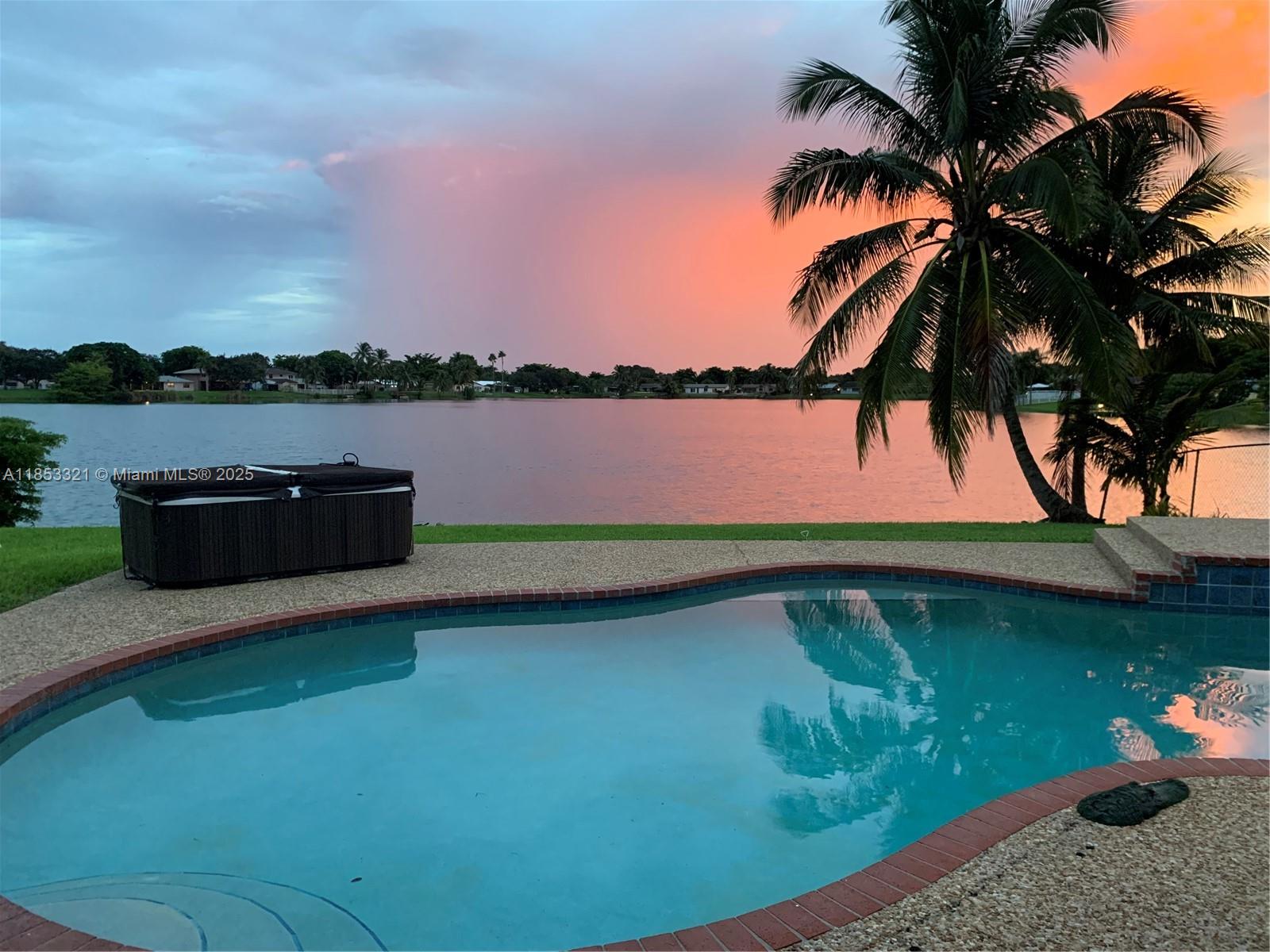 GORGEOUS POOL HOME WITH INCREDIBLE LAKE VIEWS IN THE HEART OF COOPER CITY! THIS SPACIOUS 3 BED, 2 BATH LAKE FRONT POOL HOME WITH A 2 CAR GARAGE OFFERS A WELL APPOINTED KITCHEN FEATURING GRANITE COUNTERTOPS AND DARK WOOD CABINETS. THE PRIMARY SUITE OFFERS A SPACIOUS CLOSET AND SLIDING DOOR TO THE BACKYARD AND THE PRIMARY BATHROOM FEATURES A WALK IN SHOWER WITH ACCESS TO THE POOL AREA (CAN ALSO BE A CABANA BATH). THE GUEST BATHROOM FEATURES A DOUBLE SINK AND WOOD CABINETRY. ADDITIONAL FEATURES INCLUDE TILE FLOORING THROUGHOUT, COVERED PATIO GREAT FOR ENTERTAINNG AND BREATHTAKING LAKE VIEWS. GREAT LOCATION AND ZONED FOR A+ RATED SCHOOLS. AVAILABLE FOR IMMEDIATE OCCUPANCY.