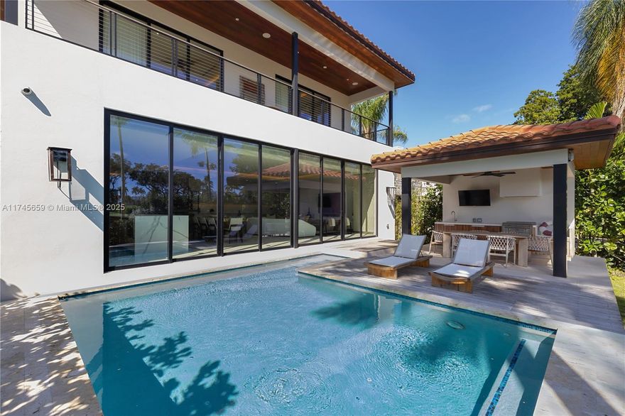 Amazing home built in 2023 by Blanco & Design.  4-Bed, 4.5-Bath.  Contemporary and Classic Smart Home with open concept kitchen, speakers throughout and power shades.  Enjoy the tranquil LED pool and outdoor kitchen under a gazebo. The home features views of La Gorce Golf Course. 2 Car Garage.  Limestone and Wood Floors.