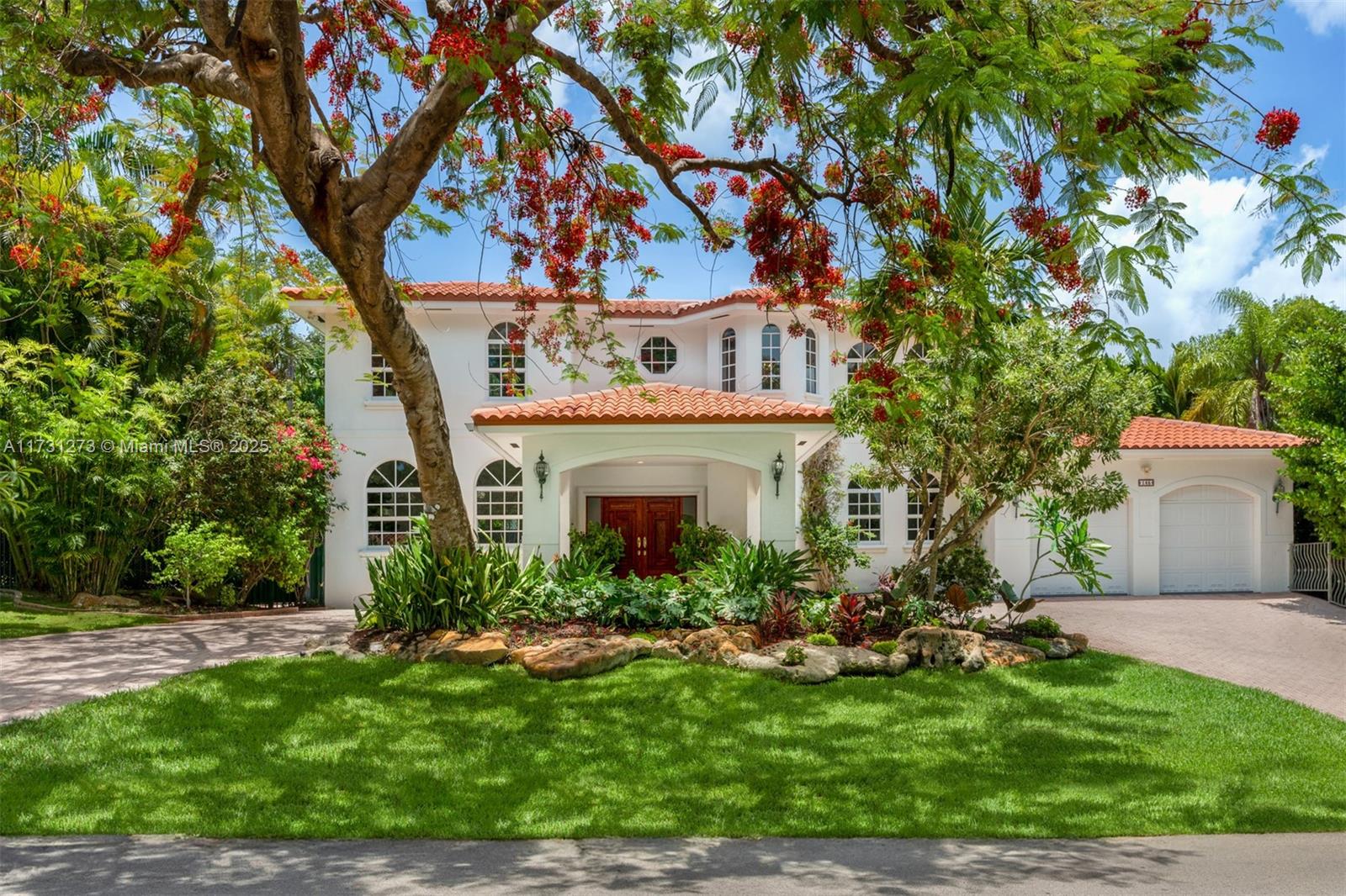 Welcome to a stunning 2-story residence that perfectly blends sophistication, comfort, and modern living in the heart of Coral Gables. The foyer opens to elegant formal living, dining, and family rooms, seamlessly connecting to a gourmet kitchen equipped with top-of-the-line appliances and a charming breakfast nook. Upstairs, enjoy the comfort of two luxurious master suites, each with its own bath, along with two additional bedrooms and a shared bath. Modern enhancements such as an integrated sound system, impact windows, and advanced security systems add to the home's allure. Outside, a private oasis awaits with a sparkling pool, jacuzzi, and lush landscaping. Complete with a 2-car garage, circular driveway, and recent upgrades, including a new roof and central AC in 2022.