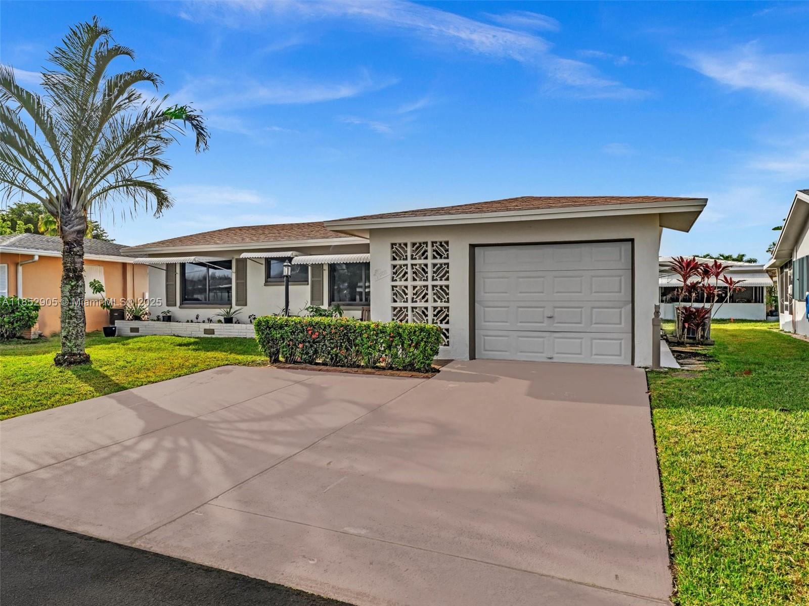 Located in a vibrant 55+ community, this beautifully updated home offers peace of mind and modern comfort. Features include hurricane impact windows and doors, new shingle roof (2022), remodeled primary and guest bathroom, new electrical panel and outlets, updated baseboards, new water resistant laminate flooring and smooth ceilings (no popcorn!). The interior and exterior have been freshly painted, and the spacious open-concept layout is filled with natural light. Both bedrooms are generously sized and comfortably accommodate king-sized beds. Enjoy the versatility of an extra space—perfect for a home office, den, or hobby space. Schedule your showing today!
