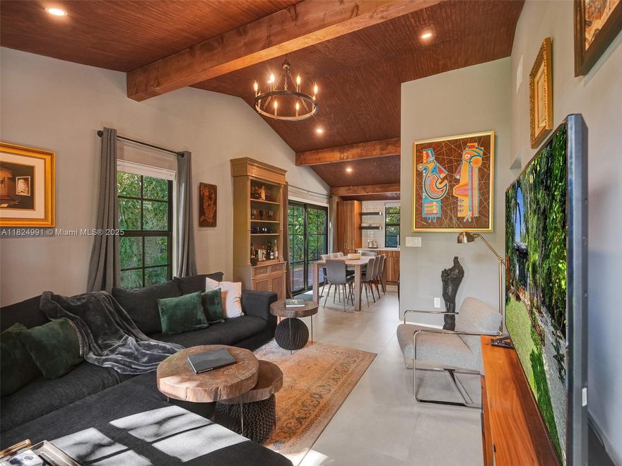 Your tropical cabin oasis awaits. Urban living w/ shops & restaurants just mins away. Surrounded by lush foliage on over 8,000 sq ft of land & over 700 sqft of wooden deck/covered pergola & outdoor BBQ make for easy outdoor living/entertainment. Including a sauna & cold plunge for your health & wellness! Remodeled 2/2, truly one of a kind, including wood beam vaulted ceilings for a cabin feel complemented perfectly w/ concrete slab tile. Impact windows & double glass door access from dining area & master bedroom allow for lots of natural light throughout. A home larger than record including a dual sink vanity in the master bath that leads out to a serene venetian-style outdoor shower. Step away from condo life and unwind in a lush tropical hideaway that feels like your own secret retreat.