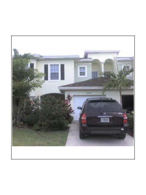 GATED COMMUNITY--17 ACRE LAKE--STEPS AWAY FROM COMMUNITY POOL AND CABANA--ALL UPGRADED APPLIANCES INCLUDING WASHER & DRYER-- AUTOMATIC GARAGE DOOR OPENER