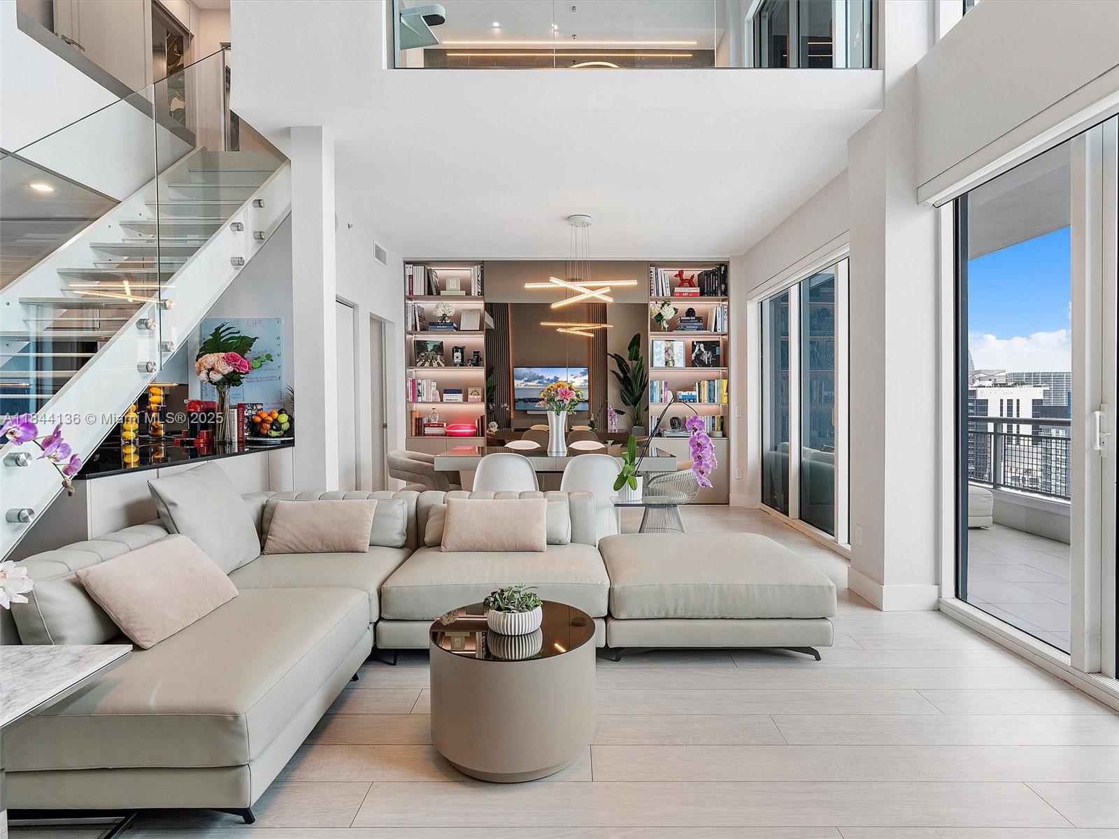 Offering one week of free rent ($1,600 off) if you lease for a year starting on or before August, 18th!
2 bedroom loft totally renovated by an interior designer with impressive water views (Key Biscayne), in the heart of Brickell. Custom carpentry and library, extra large Hot Tub for 2 people in the unit, 3 additional cabinets for a total of 6 fully equipped cabinets, kitchen extension, and other upgrades make this condo unique in Brickell. New washer/dryer. Automated blackout blinds. All services are provided by the HOA, except electricity.
Enjoy excellent amenities: swimming pool, gym, jacuzzi, sauna, etc.
Wake up to the sunrise over Key Biscayne and enjoy the view from the balcony on the first floor or the one in the master bedroom!