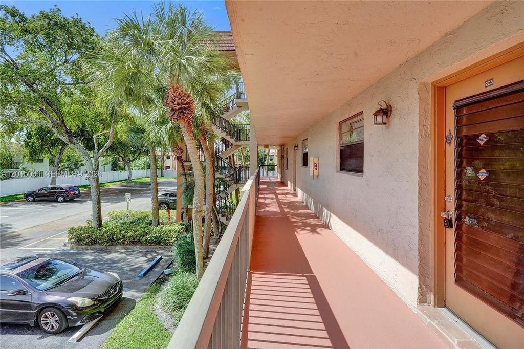Photo of 4960 E Sabal Palm Blvd #203, Tamarac, FL 33319 (MLS # A12015096)