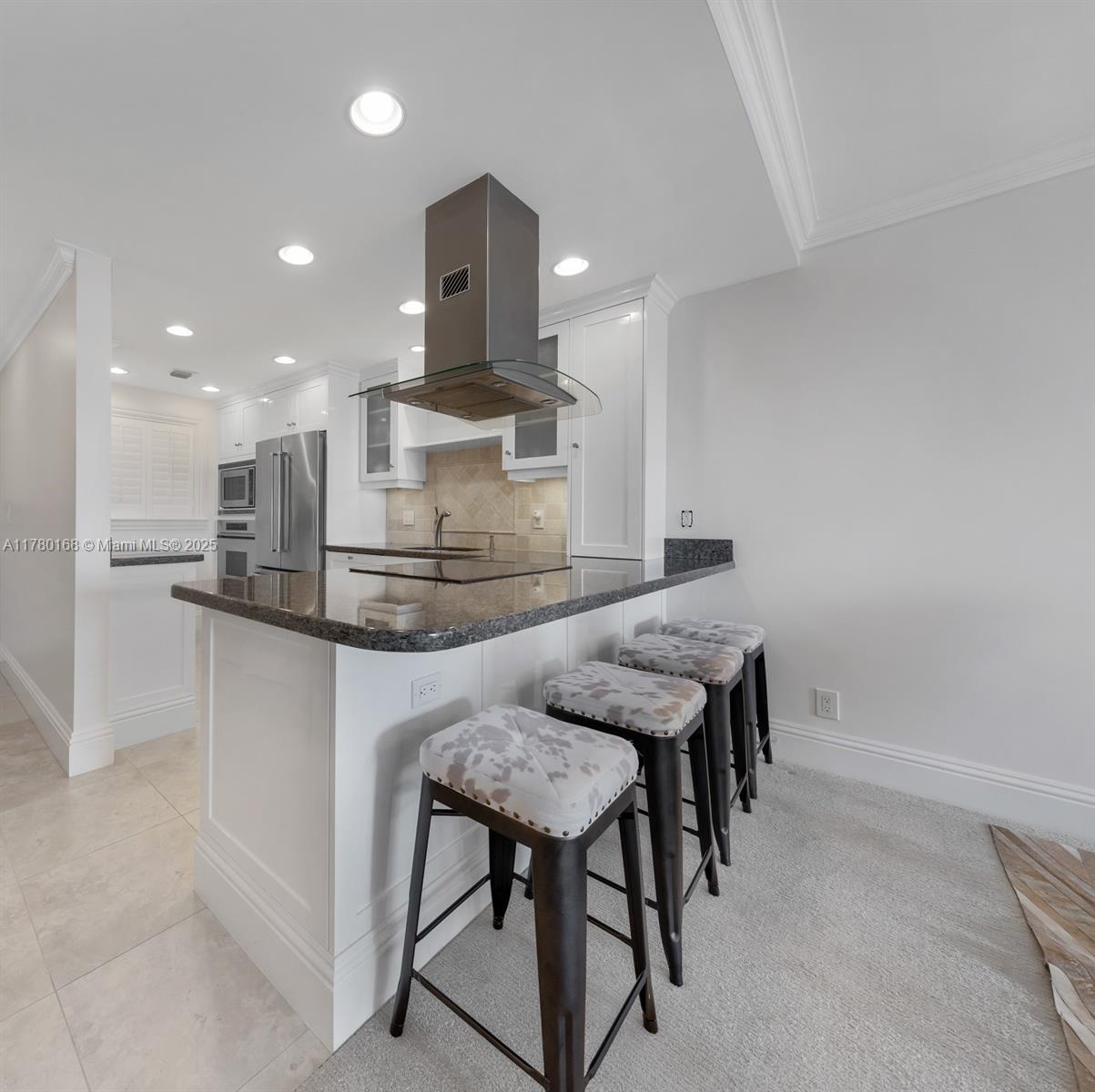 East Boca’s best kept secret! Welcome to this beautifully updated 4th floor condo located just minutes from Downtown Boca Raton, Mizner Park, the Beach & FAU. Move right in, nothing to do but enjoy the unit & the great location. This totally renovated corner unit has kitchen w/granite counters, Miele & Dacor stainless appl., crown molding, floor to ceiling hurricane windows, plantation shutters, custom walk-in closets & more. Lots of natural light, large wrap around balcony & split bedroom layout. 1 COVERED PARKING, storage spot. Water & basic cable incld. w/maint. Smoke-free 55+ commty. No need for renovation, permits & high construction costs here! Cmmty has: large pool, shuffleboard, social room, large laundry room & lots of guest parking. Listing info not warranted.