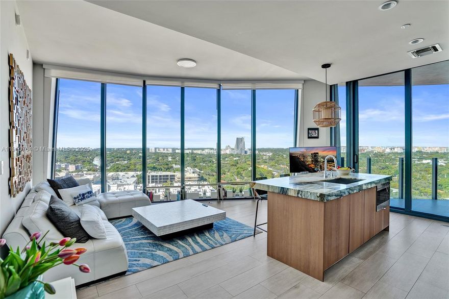 Live in the heart of Coconut Grove in this elegant 2-bed + den, 2-bath residence at Park Grove. Featuring 10’ ceilings, floor-to-ceiling glass, and a balcony with stunning city and sunset views. The chef’s kitchen boasts Sub-Zero & Wolf appliances, gas cooktop, marble counters, mirrored backsplash, and Italian cabinetry. The primary suite offers dual sinks, a soaking tub, and walk-in shower. Porcelain floors, washer/dryer, and flexible den add convenience. Enjoy resort-style amenities—rooftop pools, spa, fitness center, yoga, theater, kids’ playroom, 24-hr concierge, and valet—all moments from marinas, parks, Cocowalk, shops, and dining.