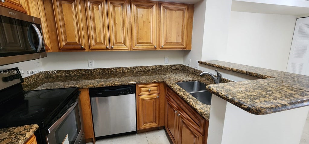 Photo of 12154 Saint Andrews Pl #110, Miramar, FL 33025 (MLS # A12034931)