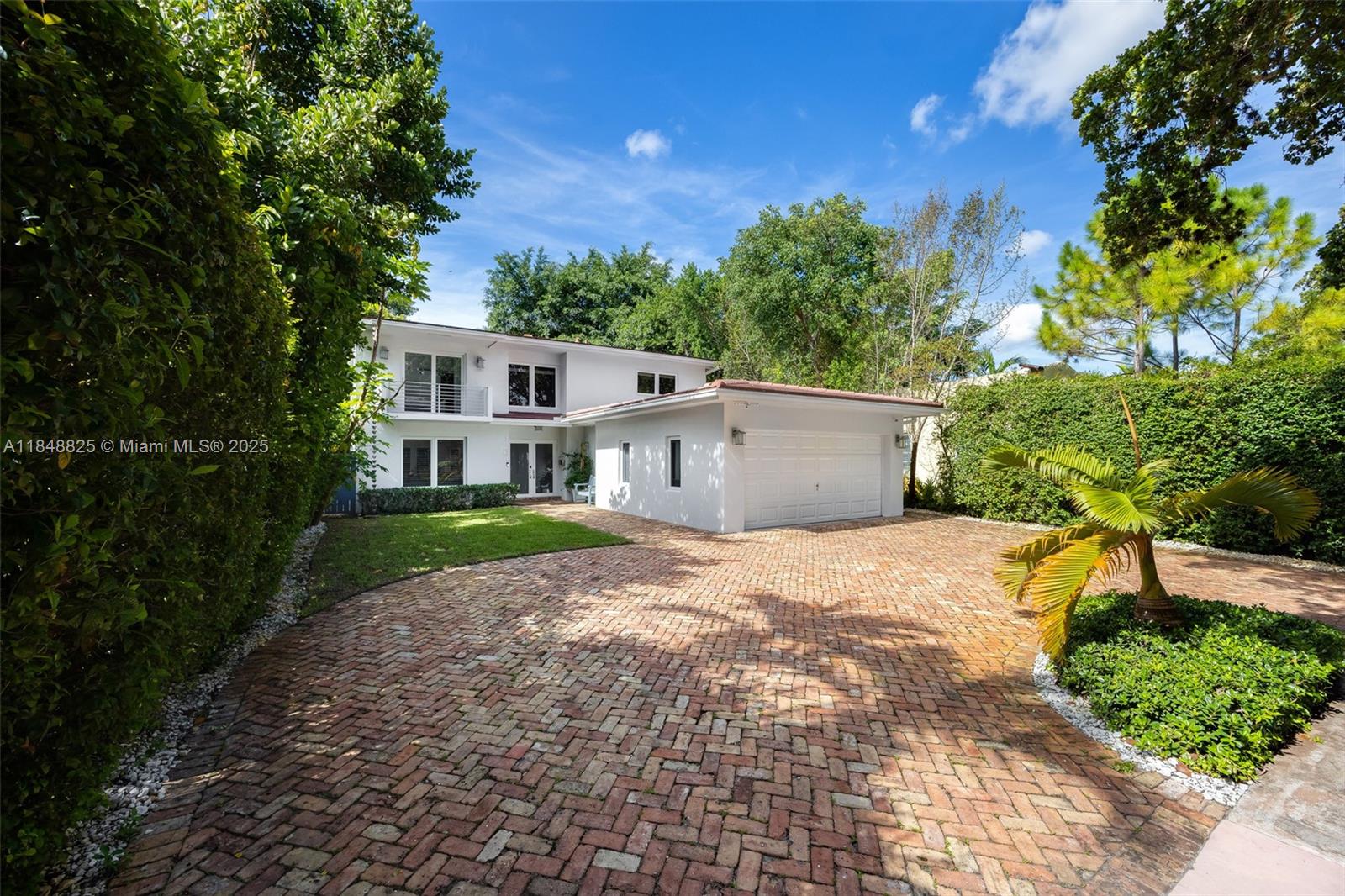 Impeccably maintained 3-bedroom, 2.5-bath home in Coral Gables, offering timeless finishes and thoughtful upgrades throughout. Features include a spacious open layout, impact windows and doors, updated plumbing and electrical, and a newer roof for peace of mind. Inside, enjoy a mix of elegant marble and warm wood floors, a bright kitchen with upgraded hardware, and electric blackouts in the main suite. Recent updates include fresh paint (inside and out), new landscaping, and added side gates for privacy. Upstairs you'll find all bedrooms plus a generous primary suite. Two-car garage, circular Chicago brick driveway, and room for a lap pool complete the package.