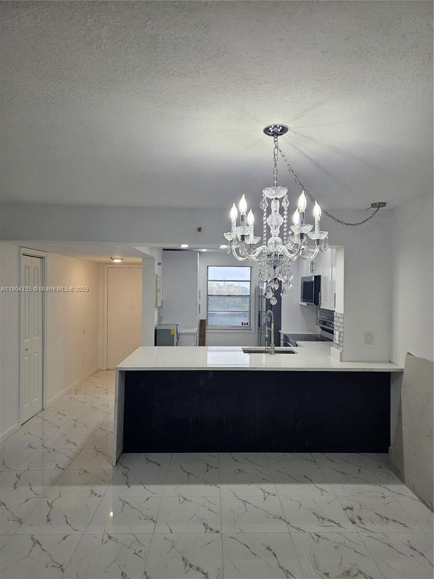 Completely remodeled, full of natural light and peaceful tree-lined views, open kitchen, new cabinets, pantry, stainless steel appliances, quartz countertop with waterfall, porcelain floors, A/C and water heather 2025, two walking closets in master bed plus closets, washer and dryer, Hurricane shutters.
Gated community, unless 1 55+, BBQ area, gazebo, HBO, internet, water, insurance and pest control included.
Assn requires 710 credit, 45K income, 6 months maintenance held in escrow. No assessments, Rentals allowed after 1 year