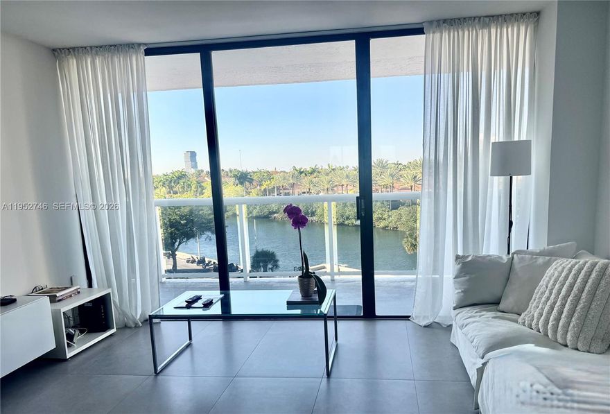 Stunning, fully renovated 2-bedroom, 2-bath residence offering a bright and spacious split floorplan with serene water views. Every room opens seamlessly onto an exceptionally wide, side-to-side private balcony—an incredibly rare feature that creates true indoor-outdoor living, perfect for both relaxing and entertaining in complete privacy.

This turnkey home has been thoughtfully redesigned with high-end finishes throughout, featuring oversized porcelain flooring, a sleek modern white kitchen with quartz countertops, custom cabinetry, and brand-new stainless steel appliances. Both bathrooms have been beautifully updated with contemporary finishes, new vanities, and elegant fixtures. Abundant closet space and generously sized bedrooms provide comfort, functionality, and privacy. 

Natural light fills the home, enhancing its open feel and tranquil ambiance. 

Waterview offers 24/7 security, valet parking, a soon-to-be resort-style pool, and a well-equipped fitness center. Ideally located just minutes from the beach, Aventura Mall, fine dining, major highways, and two international airports, all within a top-rated A+ school district.