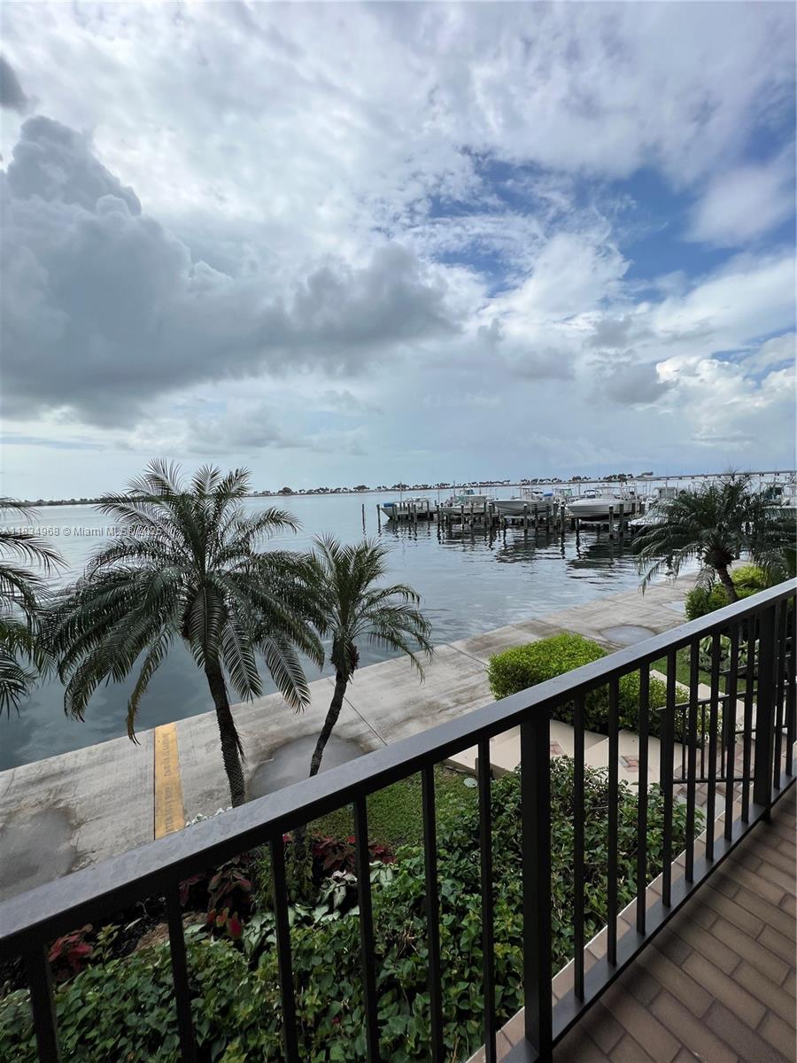Amazing water views from this Town House style property in the Brickell Place condominium. Unit has 2 master suite bedrooms on the 2nd floor. Parking for 2 cars is located right next to the door. Unit is totally remodeled and ready to move in. Don't miss this rare opportunity to live in a spectacular town house. Feels like a house, The complex has a community pool, tennis courts, gym, and much more.