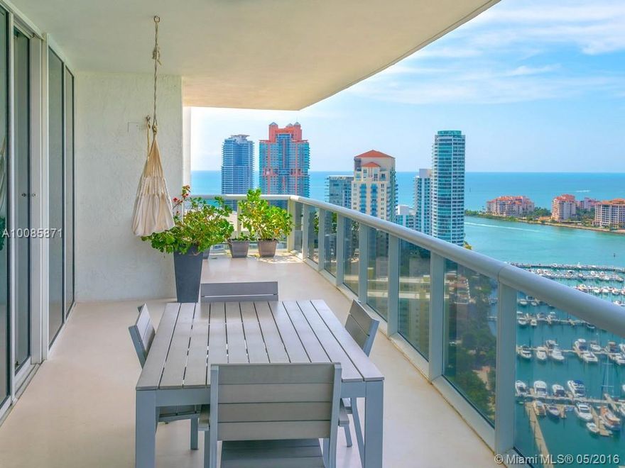 Stunning flow-thru 3,058 SF condo offers one of the most preferred & largest layouts with majestic bay, ocean, Fisher Island & Downtown Miami views. This soaring #3203 residence boasts 3 bedrooms, a large open kitchen with top-of-the line appliances & granite counters,wood floors,spacious sunset and sunrise terraces ideal for entertaining,floor-to-ceiling glass windows that extend the vistas from every room plus 5-star resort living from this signature building overlooking the marina.