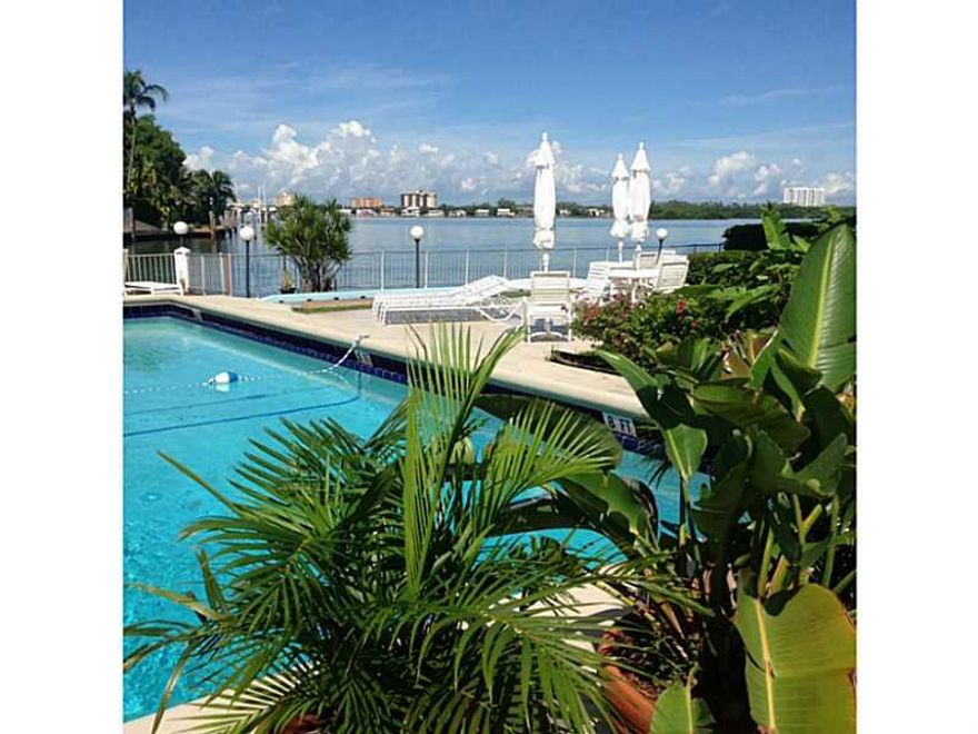 A truly UNIQUE corner 2 Bedroom /2 Bath in this waterfront MiMo building! Located on the desirable Bay Harbor Islands, this spacious home has a 360 panoramic window views of the Bay from every room, every bath, even in the kitchen! Includes built-in stora ge space, quartz stone counter tops, updated master bath, tiled thru-out. New high impact glass windows, personal dressing area with 2 closets in each bedroom. Walking distance to the world famous Bal Harbor Shops, Miami beaches & restaurants. Won't Last!