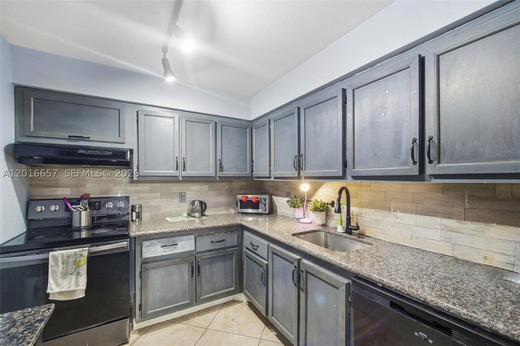 Photo of 6195 Rock Island Rd #511, Tamarac, FL 33319 (MLS # A12016657)