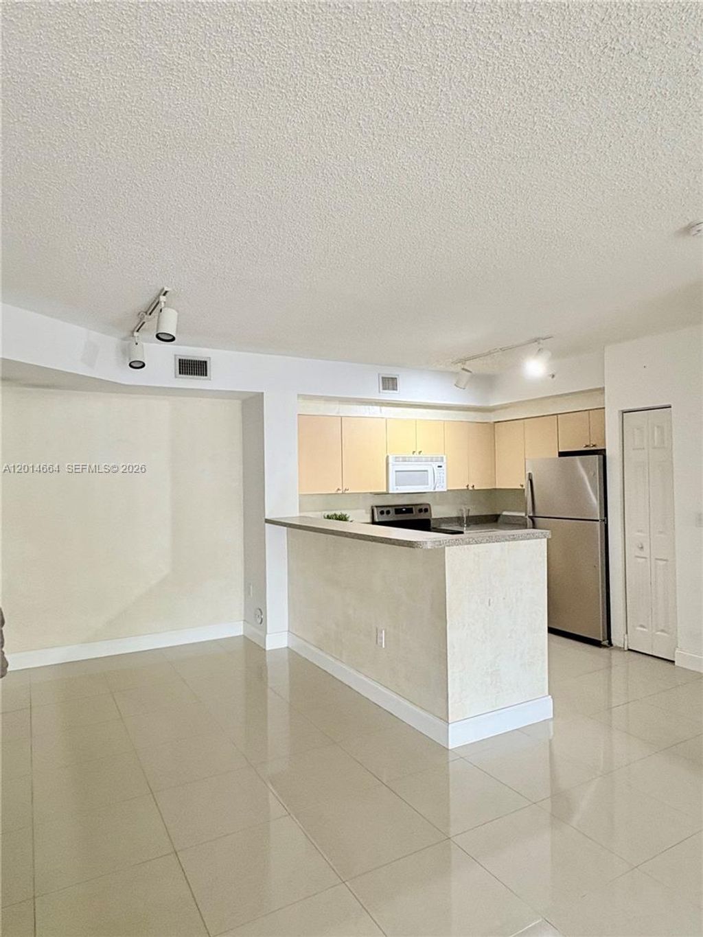 Photo of 8030 N Nob Hill Rd #105, Tamarac, FL 33321 (MLS # A12014664)