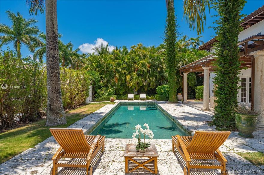 A true gem in south Coconut Grove, this Mediterranean revival villa is just 3 homes down to the bay. Set within the guard-gated Entrada Estates, this waterfront residence offers timeless architectural details with 21st century updates such as impact windows, newer roof, updated guest baths and kitchen featuring Wolf/Sub-Zero appliances. The lush gardens and pool are just steps to your private dock. Enjoy a sprawling master bedroom suite with a wood-burning fireplace, a classic master bath clawfoot tub, dual closets, and an expansive terrace overlooking the garden. The main house features 3 bedrooms & 3.5 baths plus a bonus room. The guest quarters include 2 bedrooms & 2 baths. Located near excellent private schools and minutes to  I-95, Key Biscayne, Brickell & Downtown Miami.
