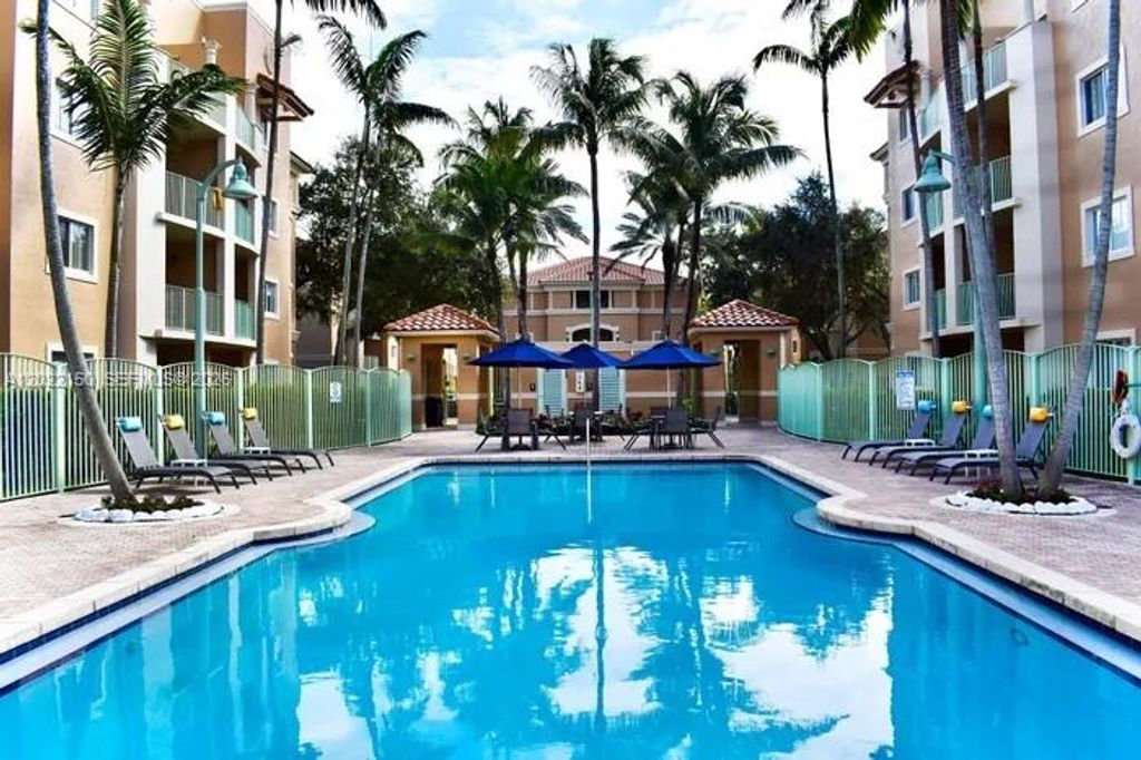 Photo of 4011 N Pine Island Rd #404, Sunrise, FL 33351 (MLS # A12022150)