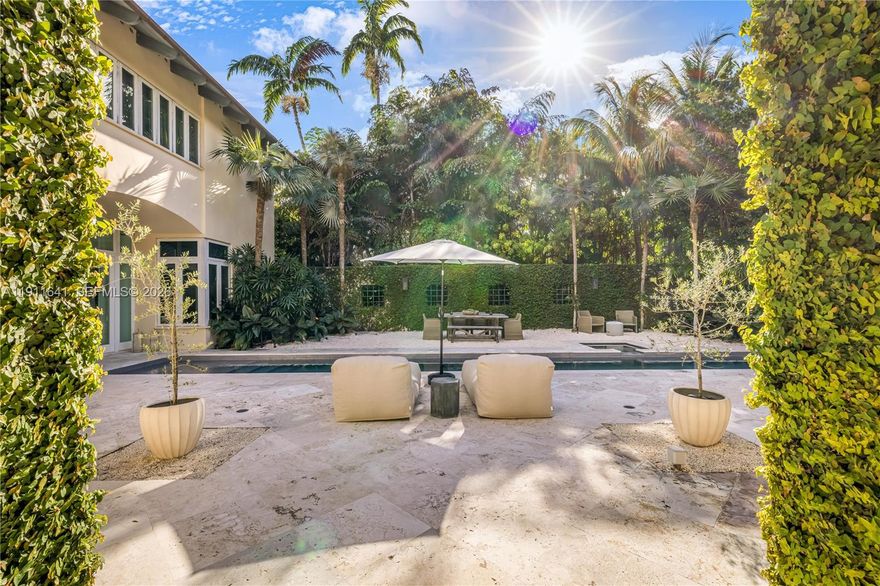 Cocoplum modern tropical luxury home. 5-beds, 5.5-baths custom residence defined by a transitional architecture and design, seamless indoor–outdoor living. An open plan with soaring ceilings showcases a chef’s kitchen - dark granite, gold accents, butcher-block island, pro appliances-, a serene primary suite, and dedicated wellness spaces including a high-end gym, steam and dry sauna. A resort-style lap pool & spa anchor an expansive stone patio with a fully equipped outdoor kitchen, including pizza oven, grill, ice-maker, wine cooler, private dining, lush landscaping, and privacy hedge. Very high elevation with a rare NO flood insurance necessary, a dark metal roof, and an elegant paver drive complete this exceptional turnkey residence.